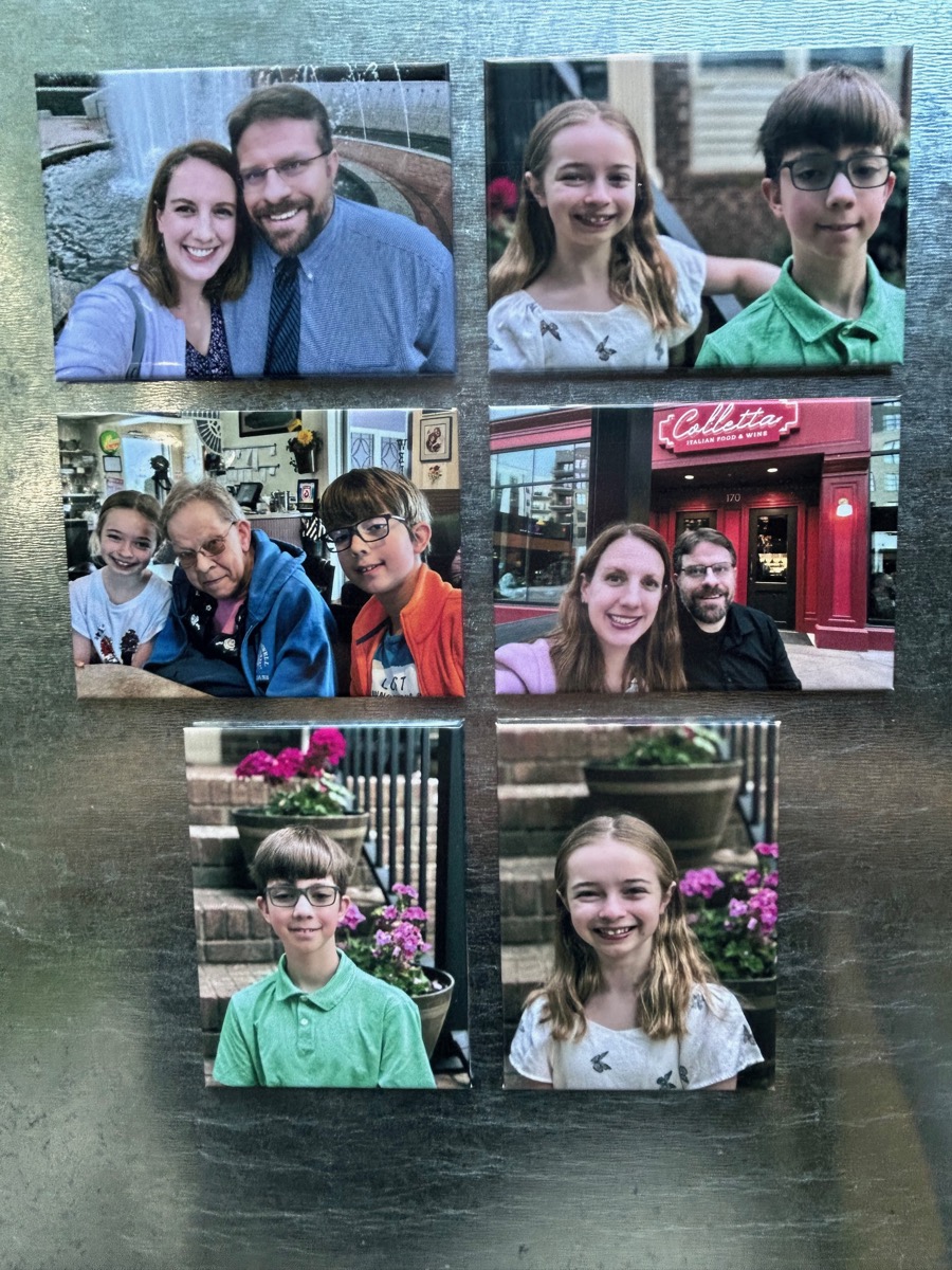 Custom photo magnets on a fridge